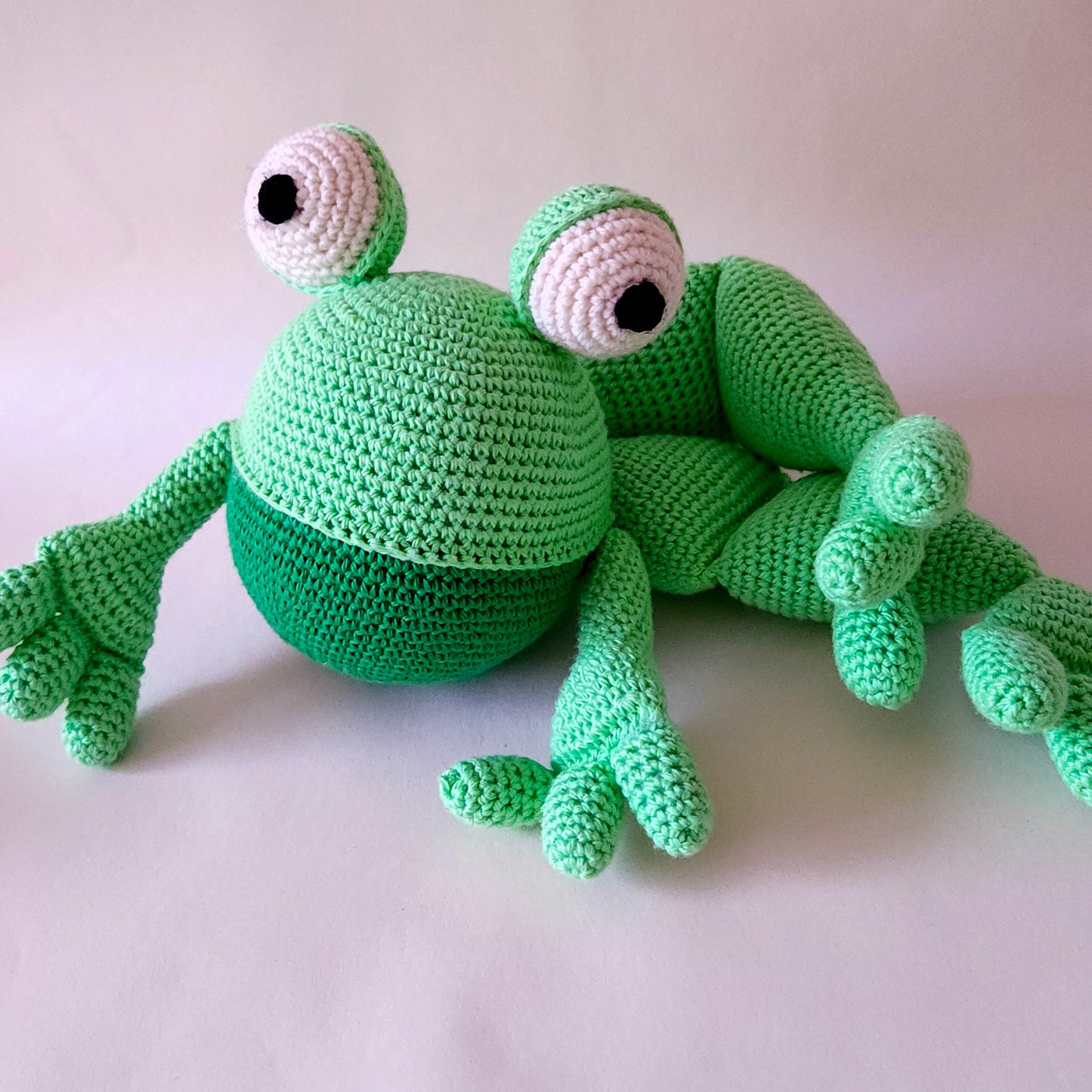 Soft cuddly toy frog in green and green