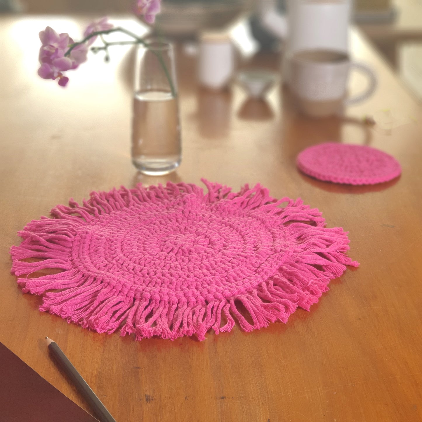 Colourful table set in crocheted cotton