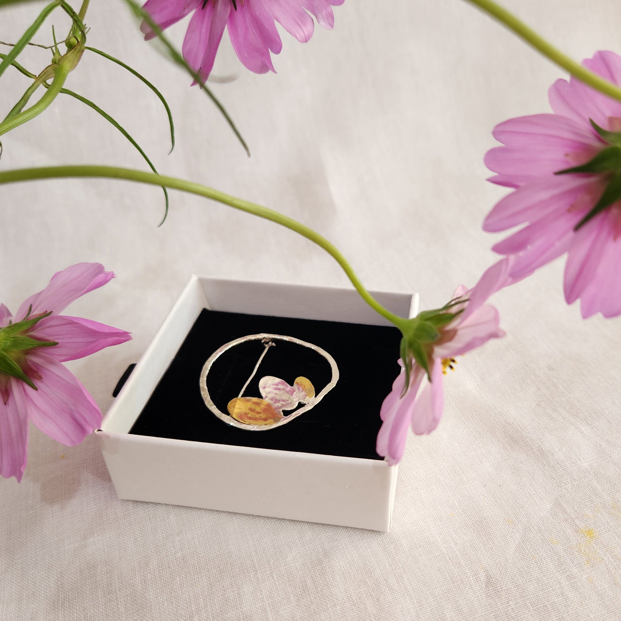 Silver brooch with tiny petals