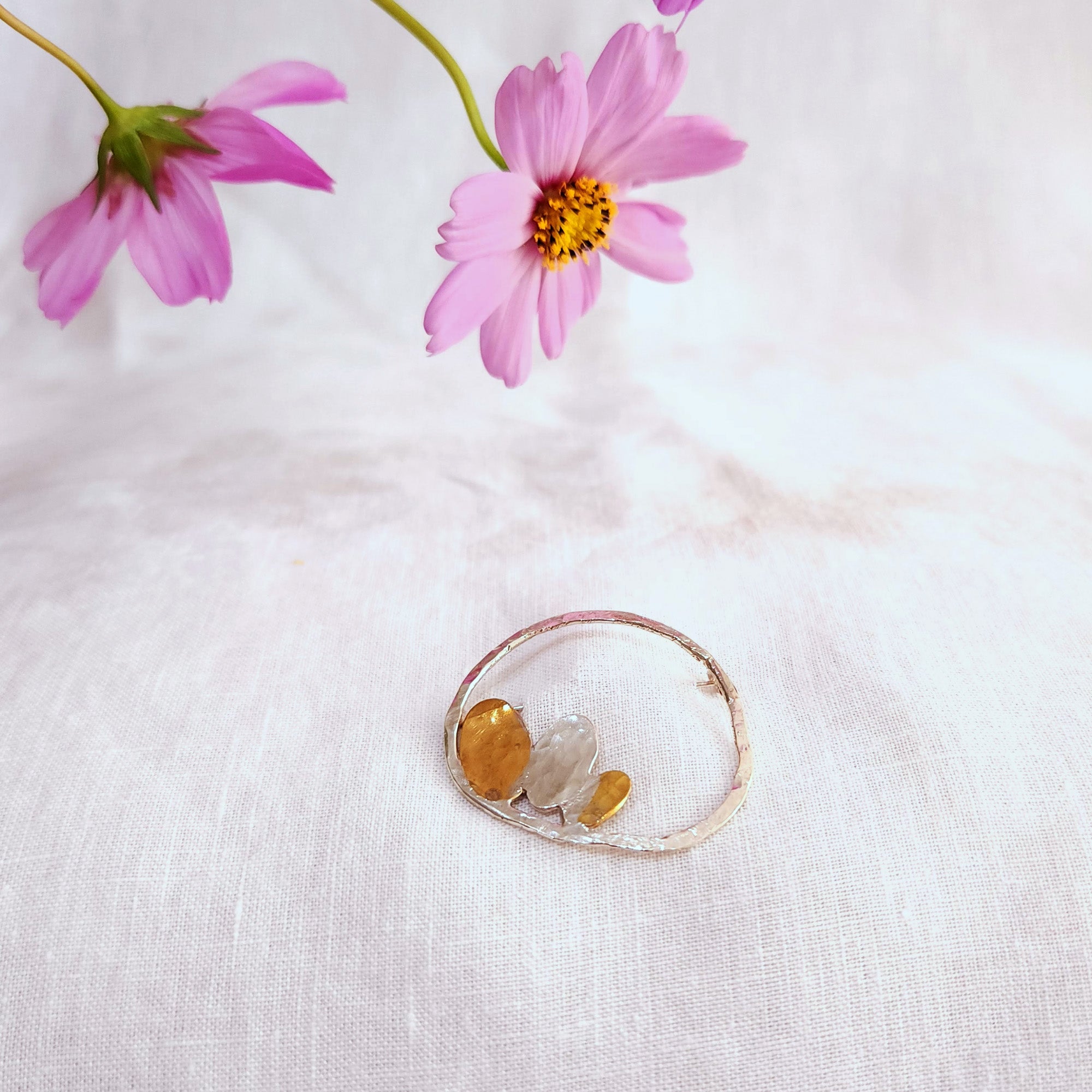 Silver brooch with tiny petals