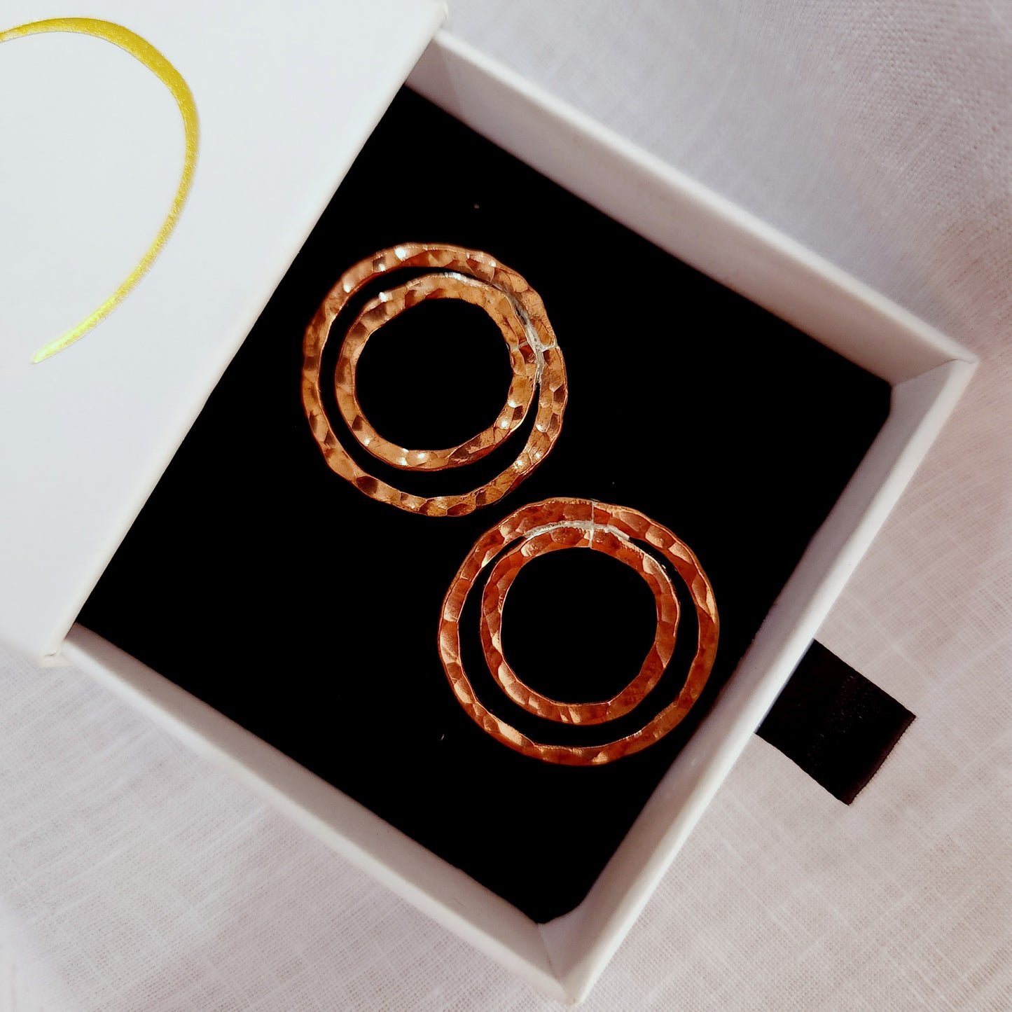 Shimmering beaten copper circle earrings