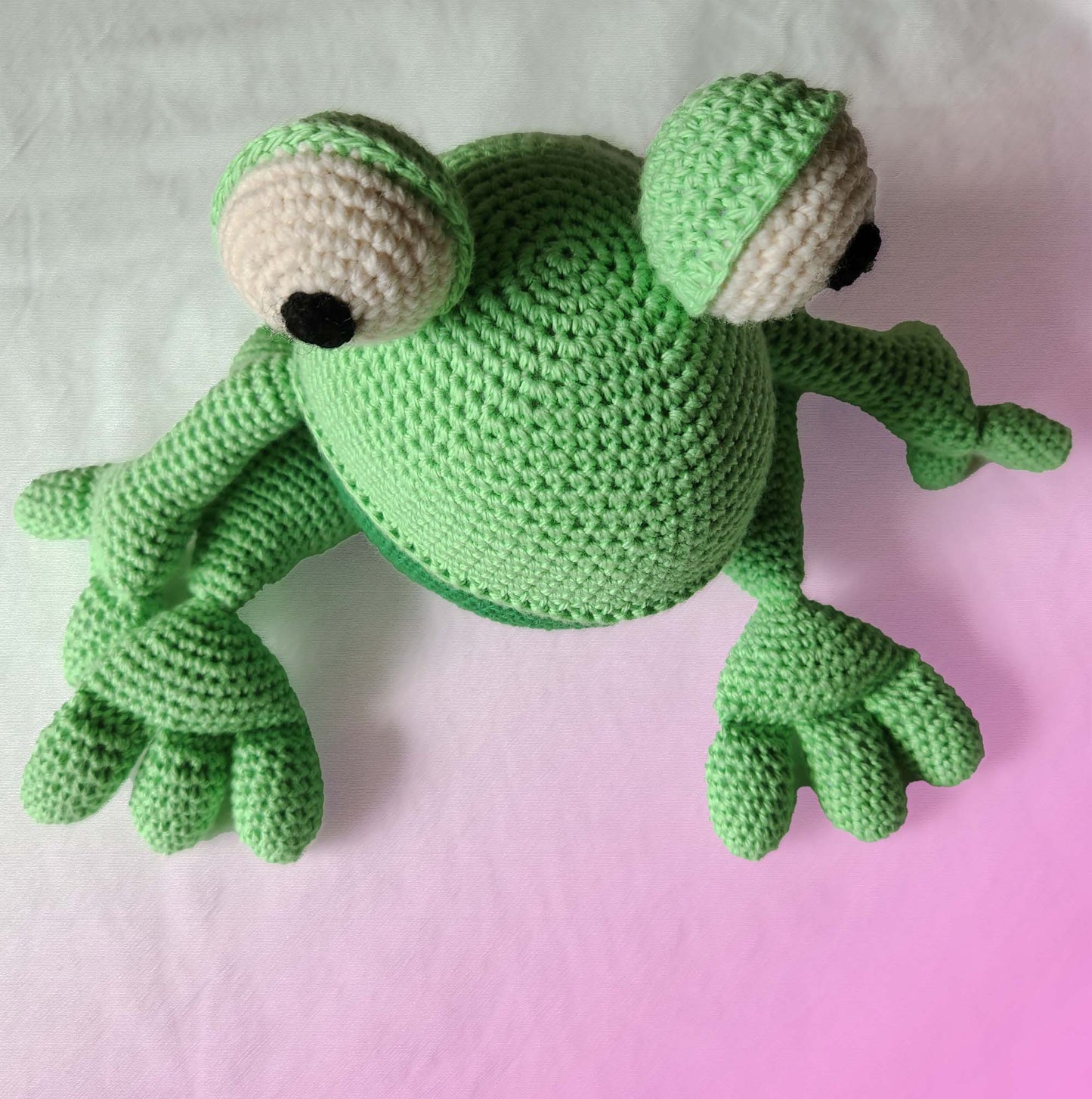 Soft cuddly toy frog in green and green