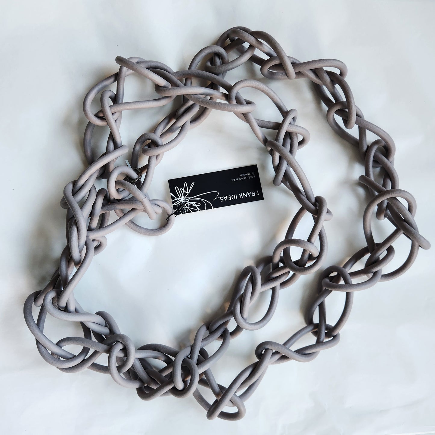 Chaotic necklace in warm grey