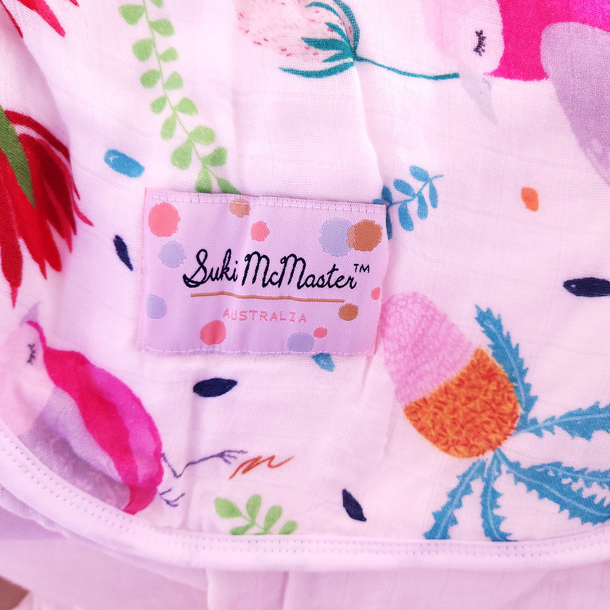 Organic swaddle blanket with birds and flowers