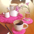 Colourful table set in crocheted cotton