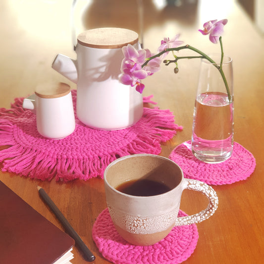 Colourful table set in crocheted cotton