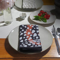 Linen serviettes in black and white