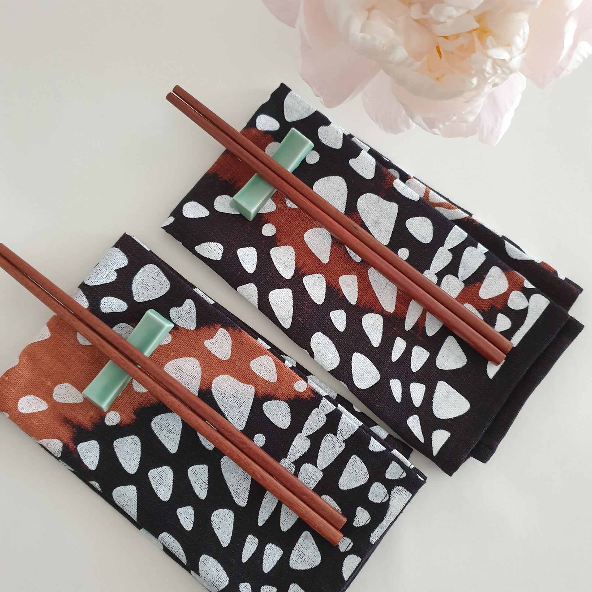 Linen serviettes photographed with chopsticks